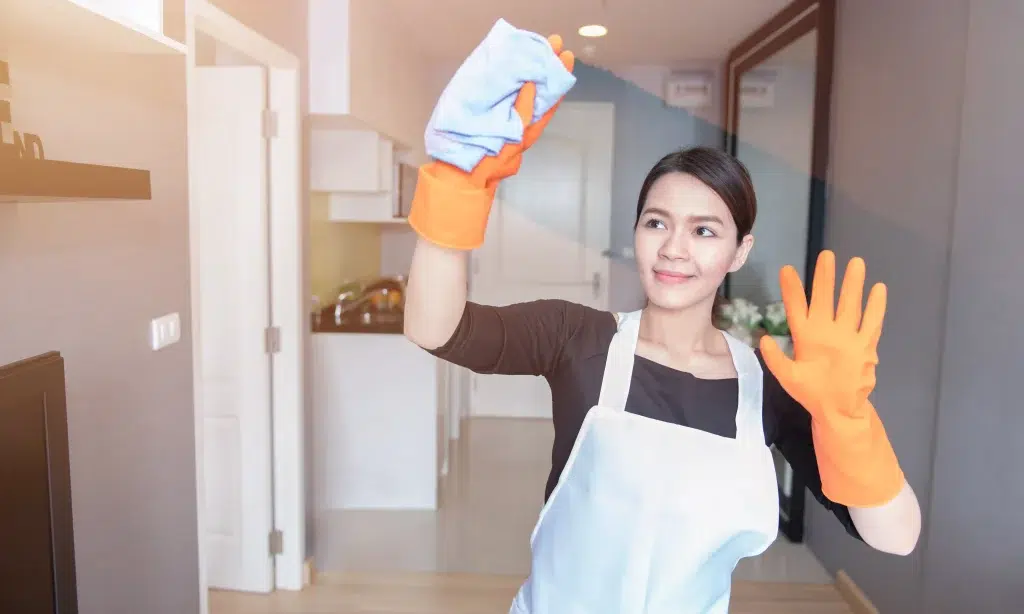 A transfer maid in Singapore cleaning the kitchen, already familiar with local household routines and ready to start work quickly.