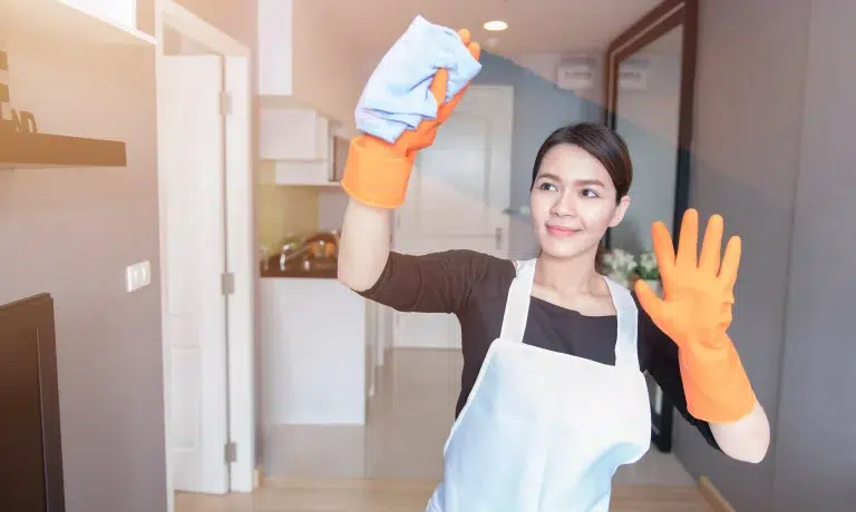A transfer maid in Singapore cleaning the kitchen, already familiar with local household routines and ready to start work quickly.